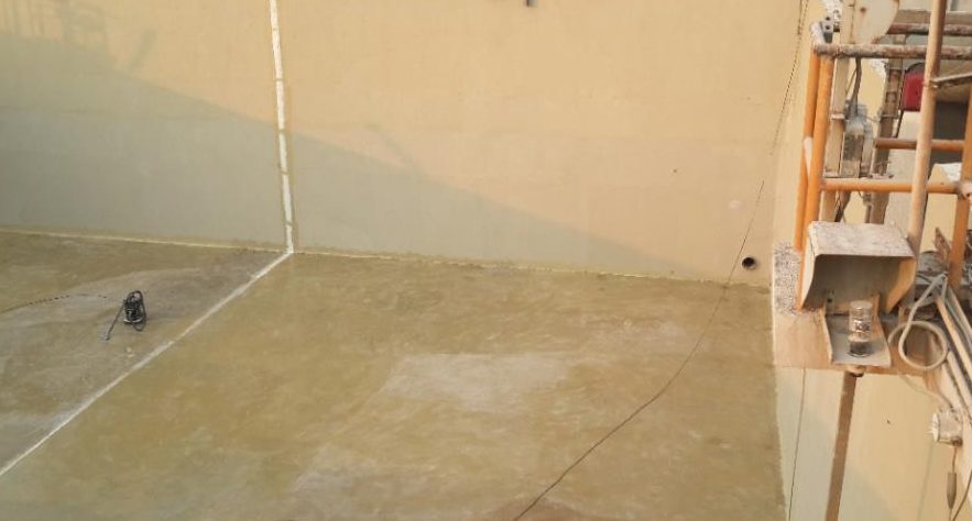 Coated concrete tank wall